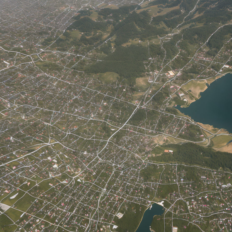 Dense Urban Area with Waterfront and Forested Hills