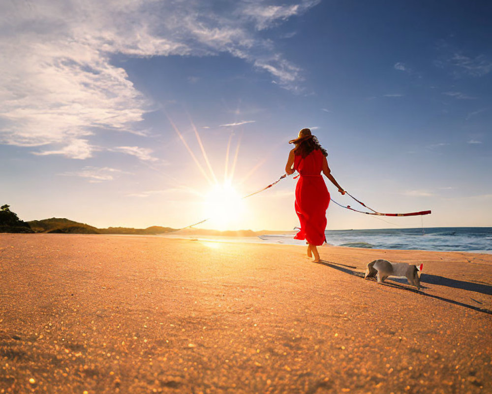 Person in Red Dress Walking Dog on Beach at Sunset