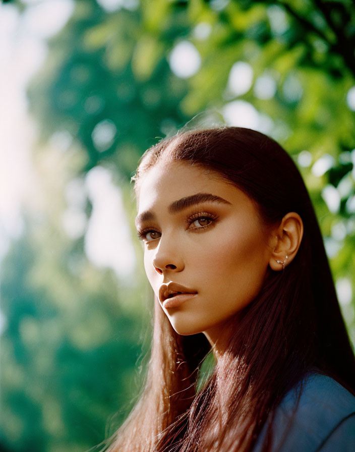 Portrait of Woman with Prominent Cheekbones and Brown Eyes in Natural Daylight