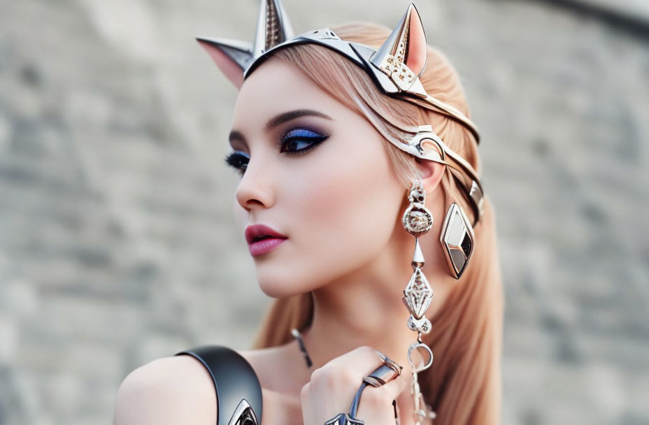 Striking makeup and avant-garde cat ears headdress with silver jewelry