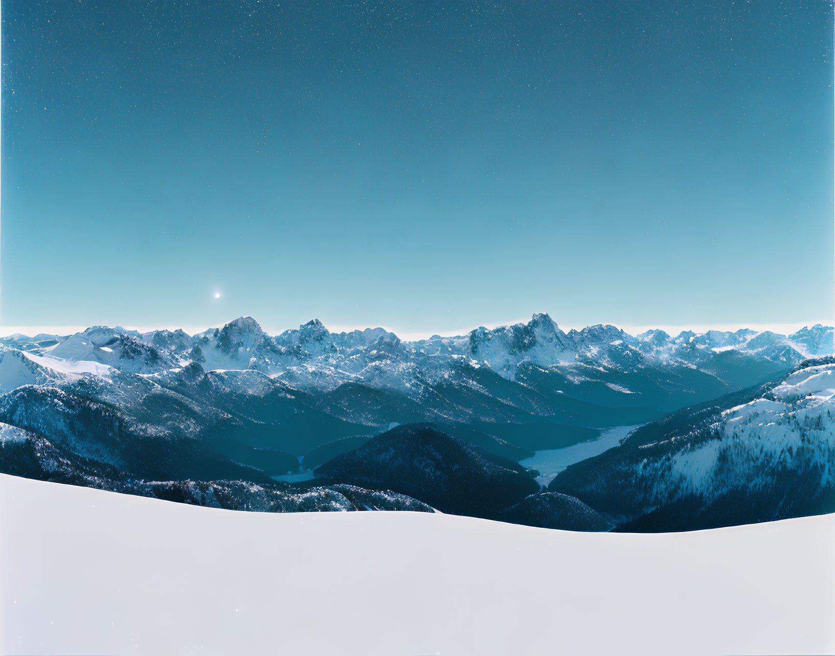 Snowy Mountain Range Panoramic View with Serene Lake and Starry Sky