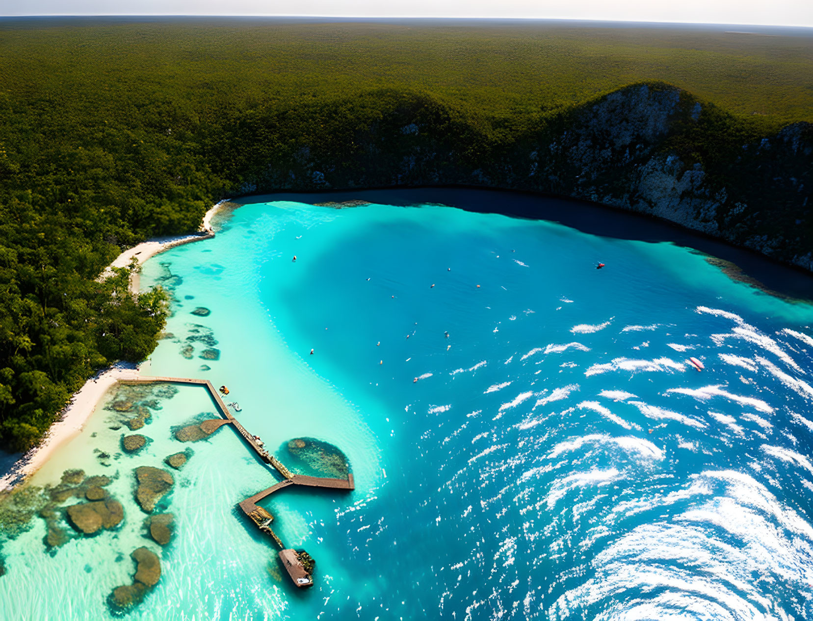 Serene Turquoise Bay with Sandy Beach and Pier