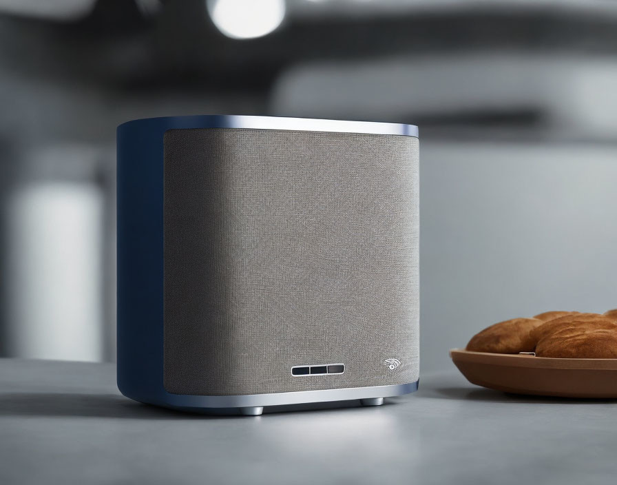 Blue and Gray Smart Speaker with Croissants on Kitchen Countertop