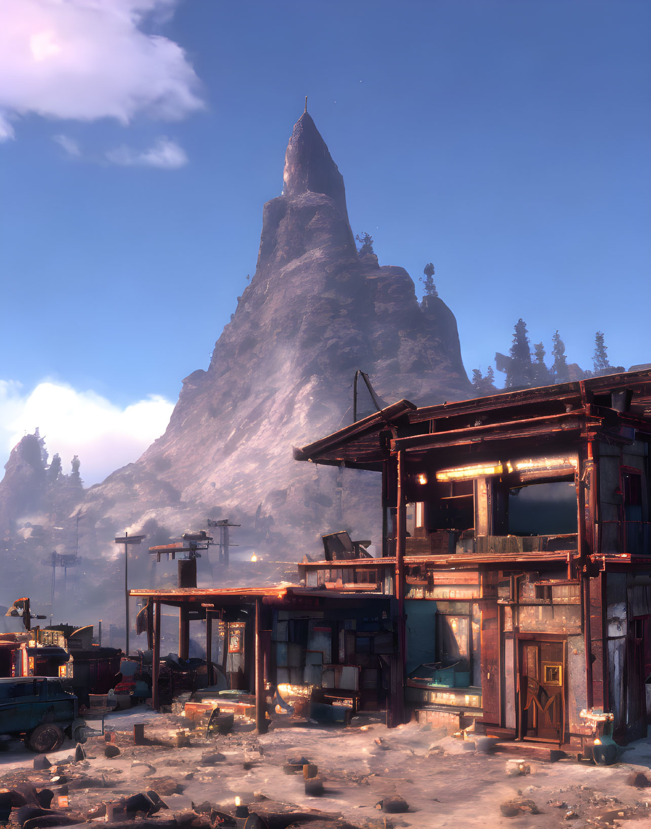 Rustic settlement at base of sharp mountain peak under hazy sky