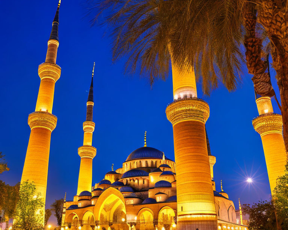 Twilight scene of illuminated mosque with tall minarets, people walking, and palm trees.