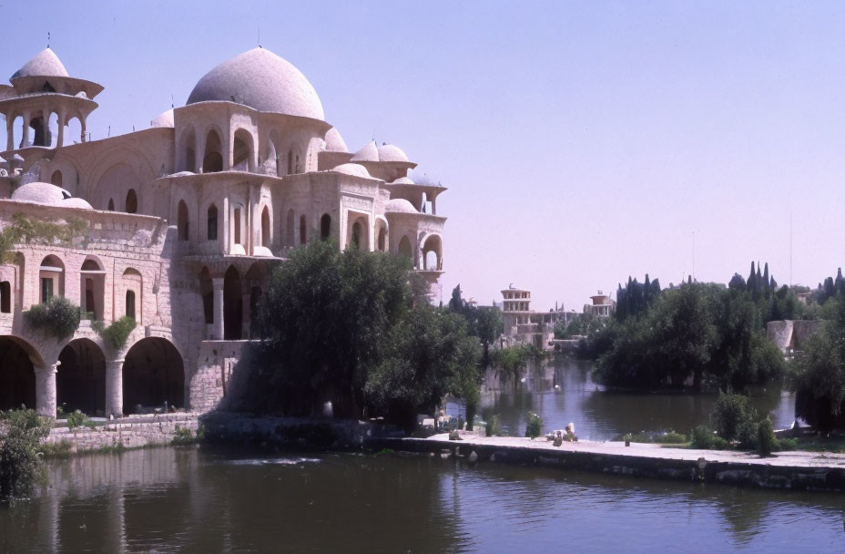 Tranquil Riverfront Scene with Grand Domed Building