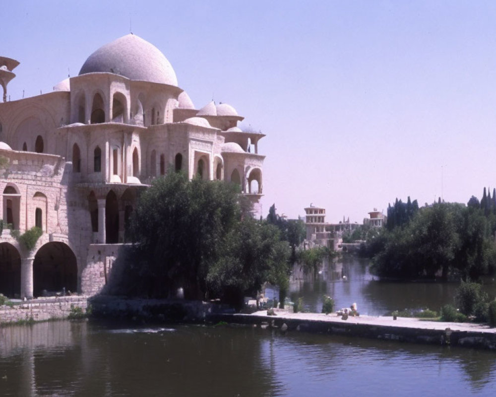 Tranquil Riverfront Scene with Grand Domed Building