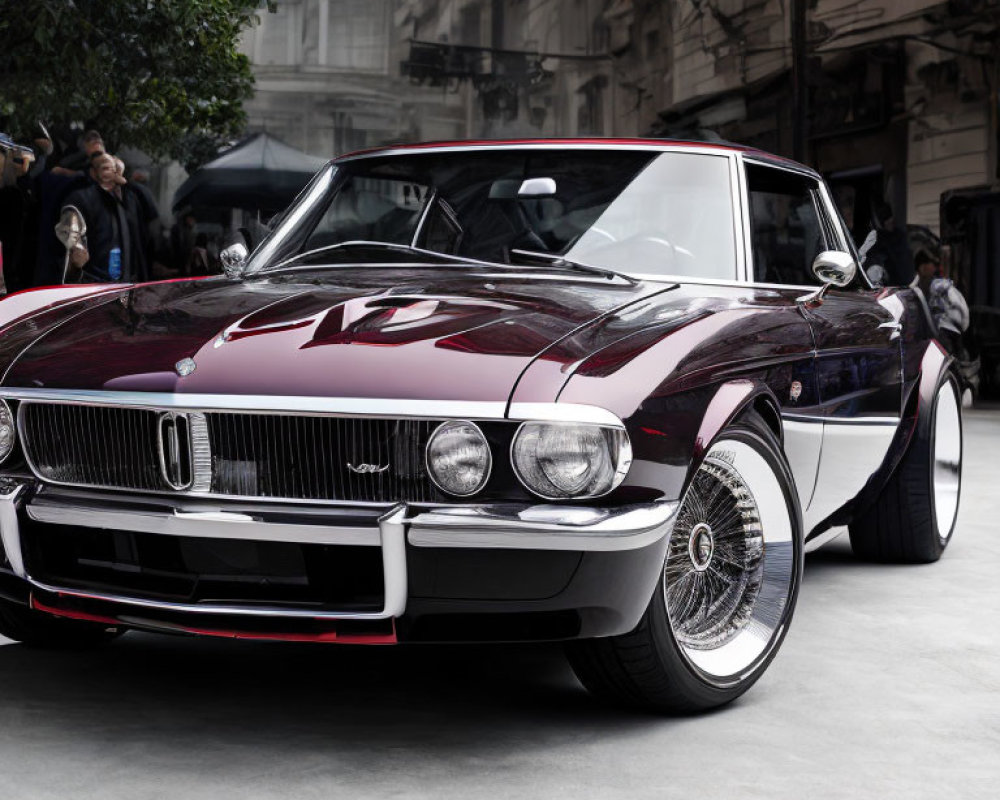 Vintage Burgundy Car with Chrome Detailing and Wire Spoke Wheels at Indoor Event