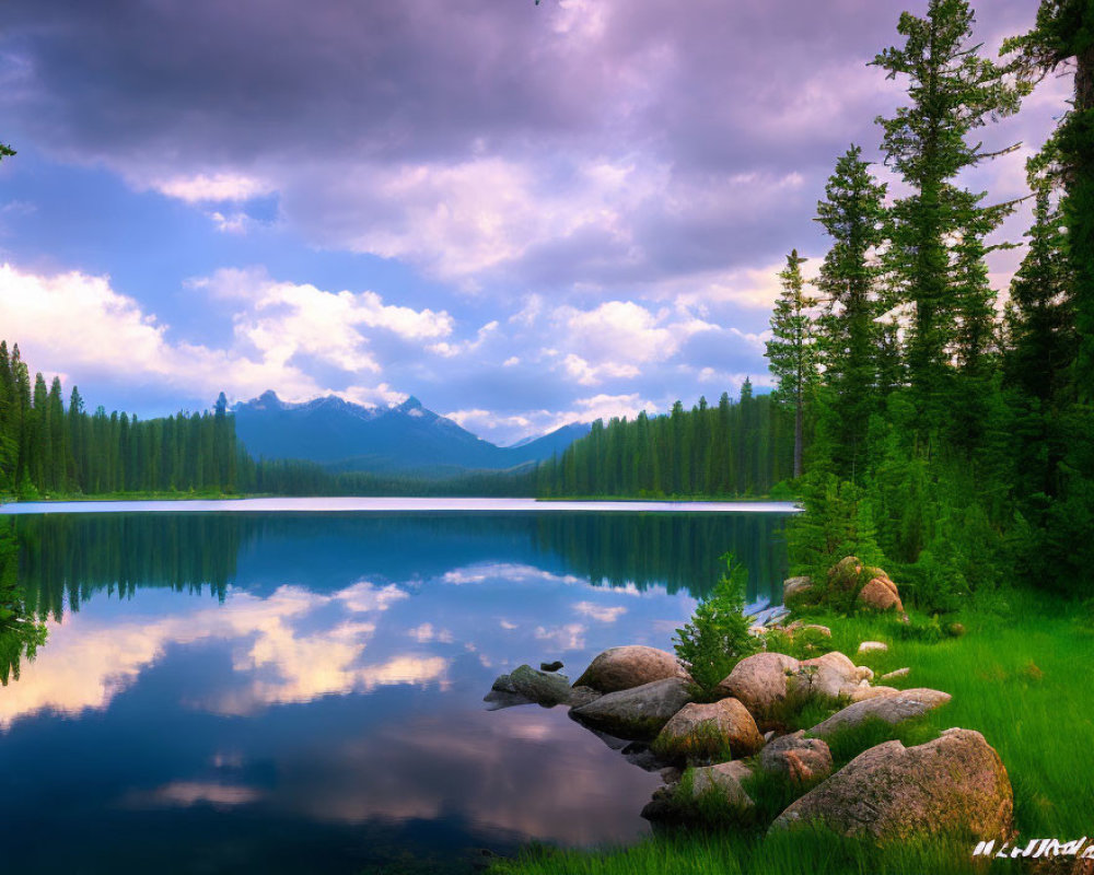 Scenic lake with mirrored trees, purple sky, and mountain backdrop