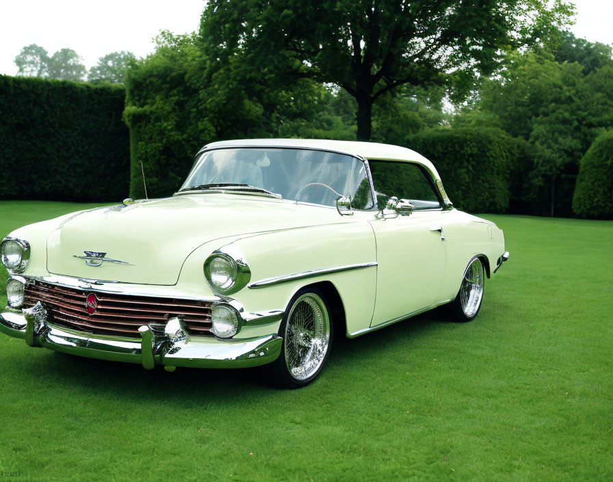 Mint Green Classic Convertible Car with White Top and Chrome Detailing