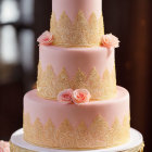 Pink Tiered Cake with Gold Lace Patterns and Pink Roses on Dark Background