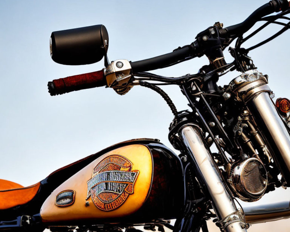 Vintage Motorcycle Tank with Emblem, Handlebars, Mirror, and Leather Seat