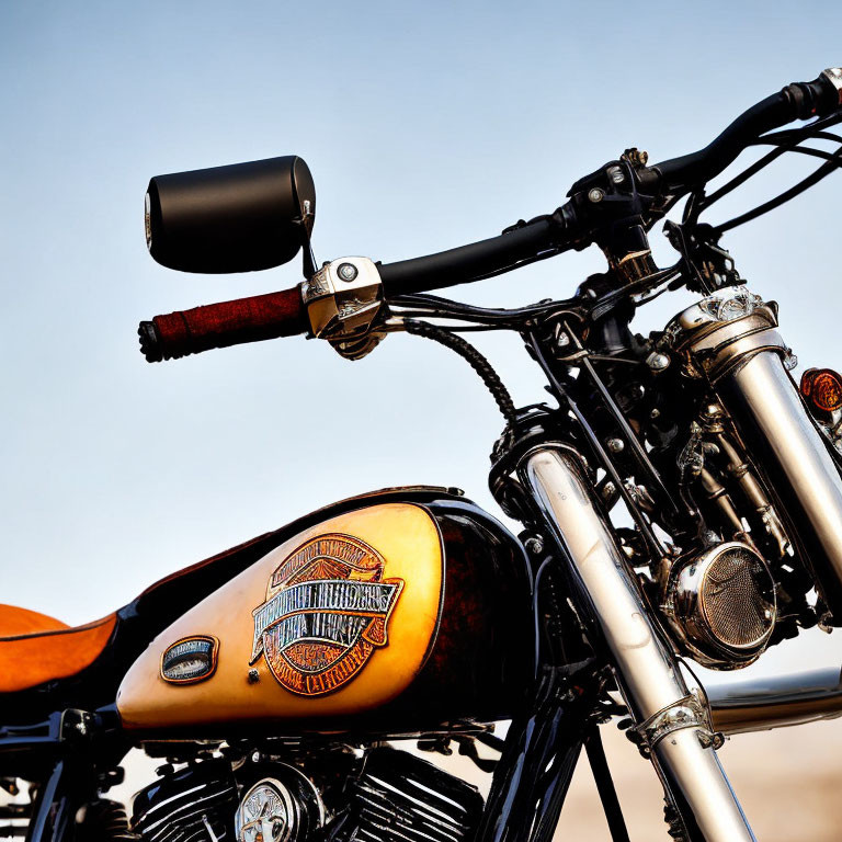 Vintage Motorcycle Tank with Emblem, Handlebars, Mirror, and Leather Seat