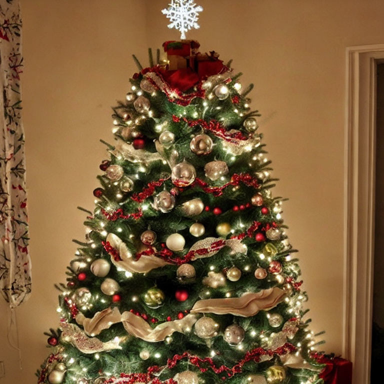 Festive Christmas tree with gold and red decorations in cozy room corner