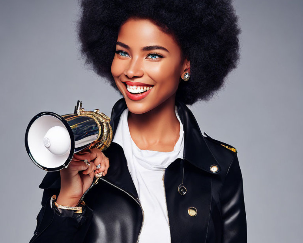 Woman with Afro Smiles Holding Megaphone in Leather Jacket