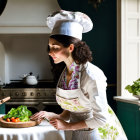 Chef garnishing dish in well-lit kitchen with traditional attire