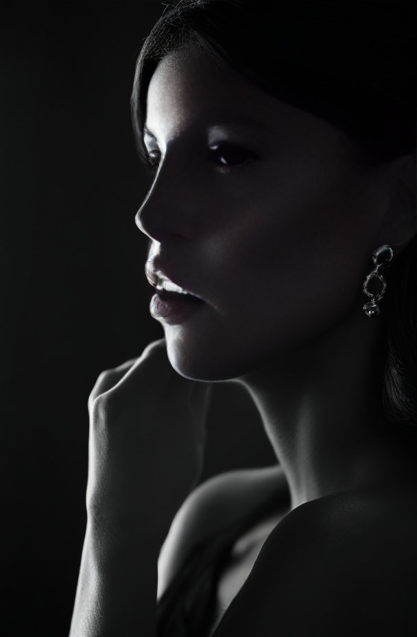 Monochrome portrait of woman with soft lighting and contemplative expression