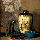 Ornate blue and white vase with colorful flowers and fruit on tabletop