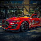 Vibrant red sports car with gold patterns on cosmic background