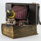 Vintage Brass-Lens Camera with Matching Ornate Suitcase