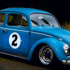 Illustration of Classic Volkswagen Beetle with Teal and Pink Paint Job