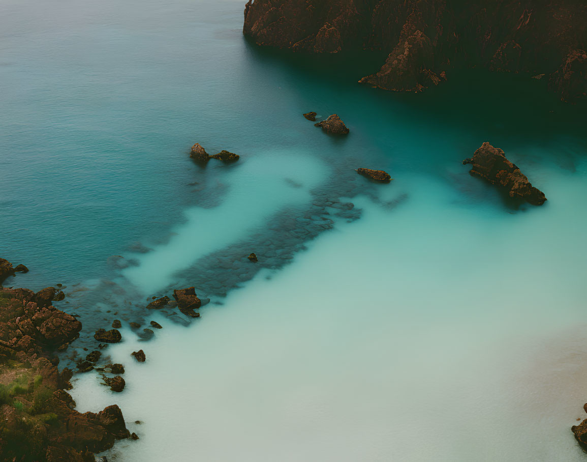 Turquoise Waters and Rocky Cliffs in Coastal Aerial View