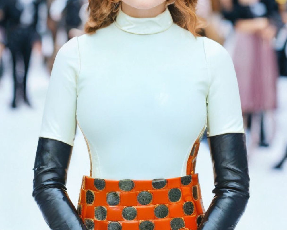 Curly Brown-Haired Woman in Blue Turtleneck and Orange Skirt Outdoors