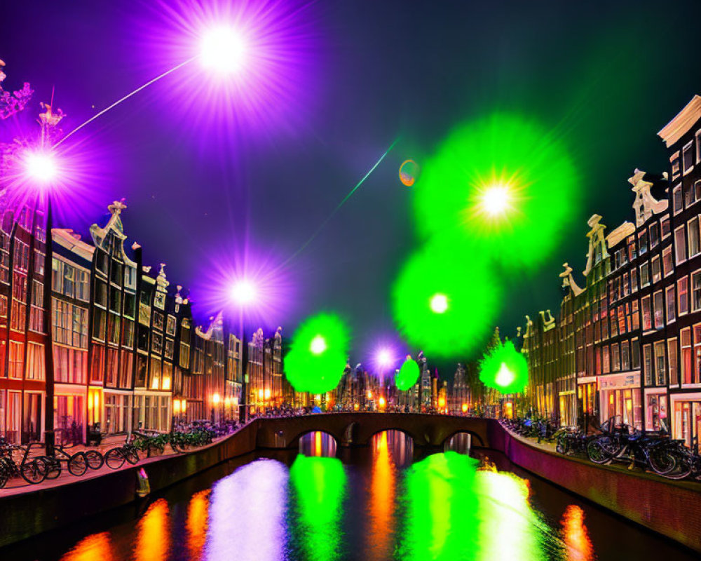 Amsterdam canal at night with illuminated buildings and bikes