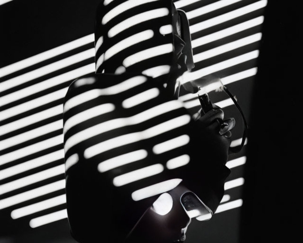 Monochromatic photo of person in leather jacket with white light shadows