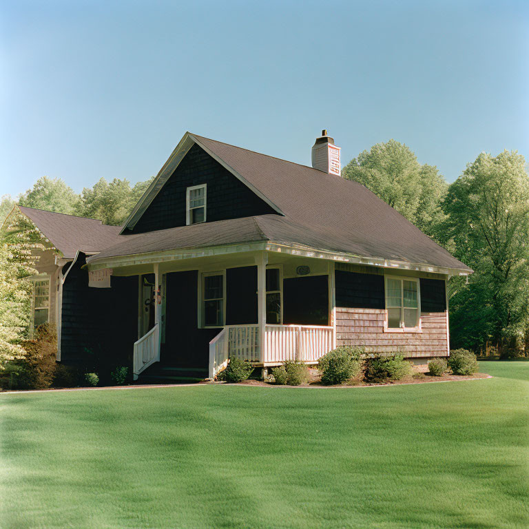 Red Brick House with Gabled Roof and Chimney in Green Landscape