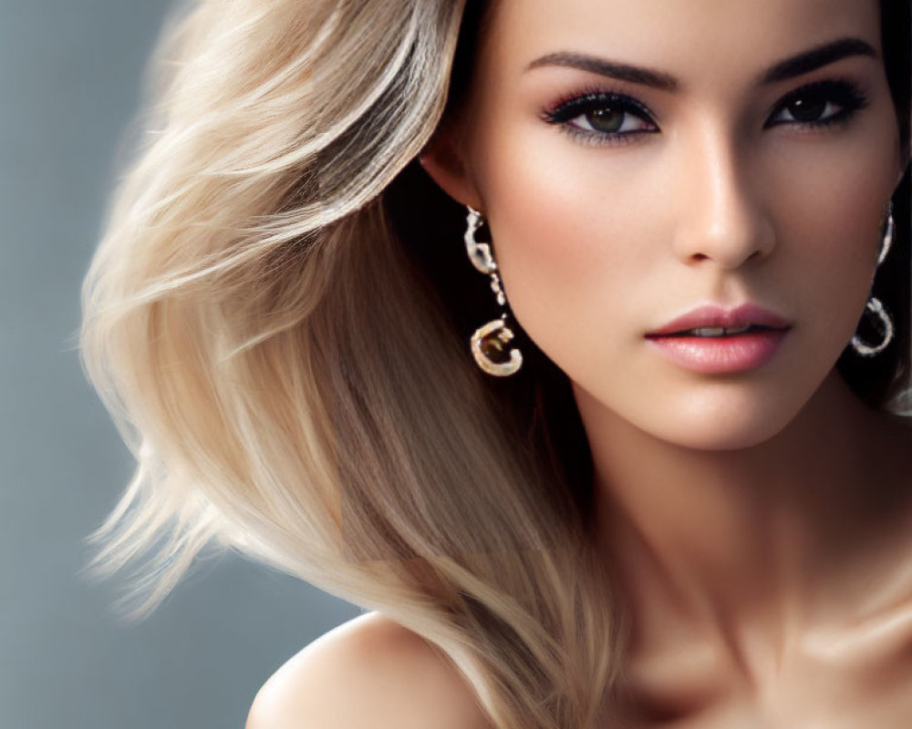 Blonde woman portrait with flowing hair and elegant earrings