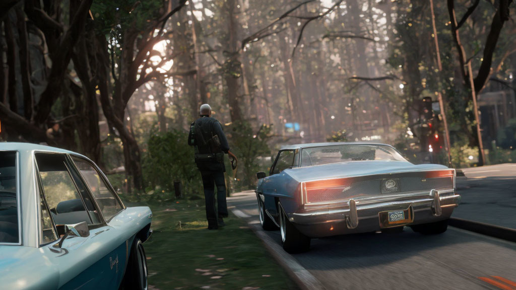 Person beside classic car on sunlit road with trees