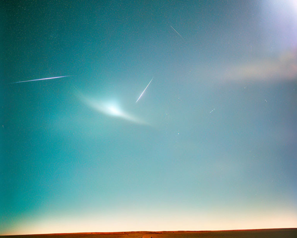 Group of People Under Starry Sky with Meteor Trails on Vast Twilight Landscape