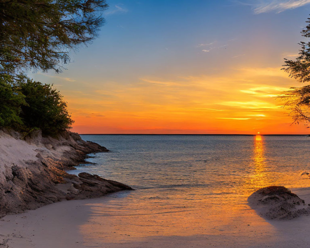 Tranquil sunset beach scene with orange sky, sun setting, gentle waves, sandy shore, rocks