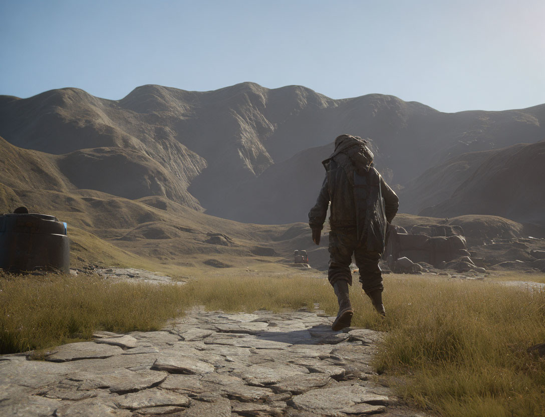 Hiker with large backpack on stone path in mountainous desert landscape