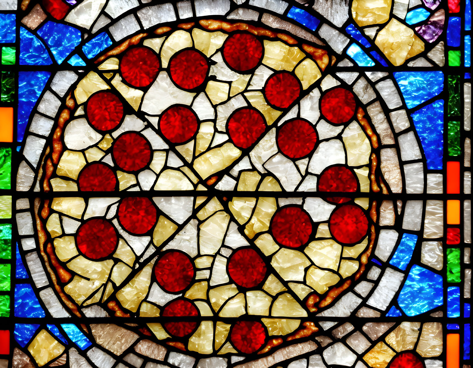 Vibrant stained glass window with red circles in mosaic pattern