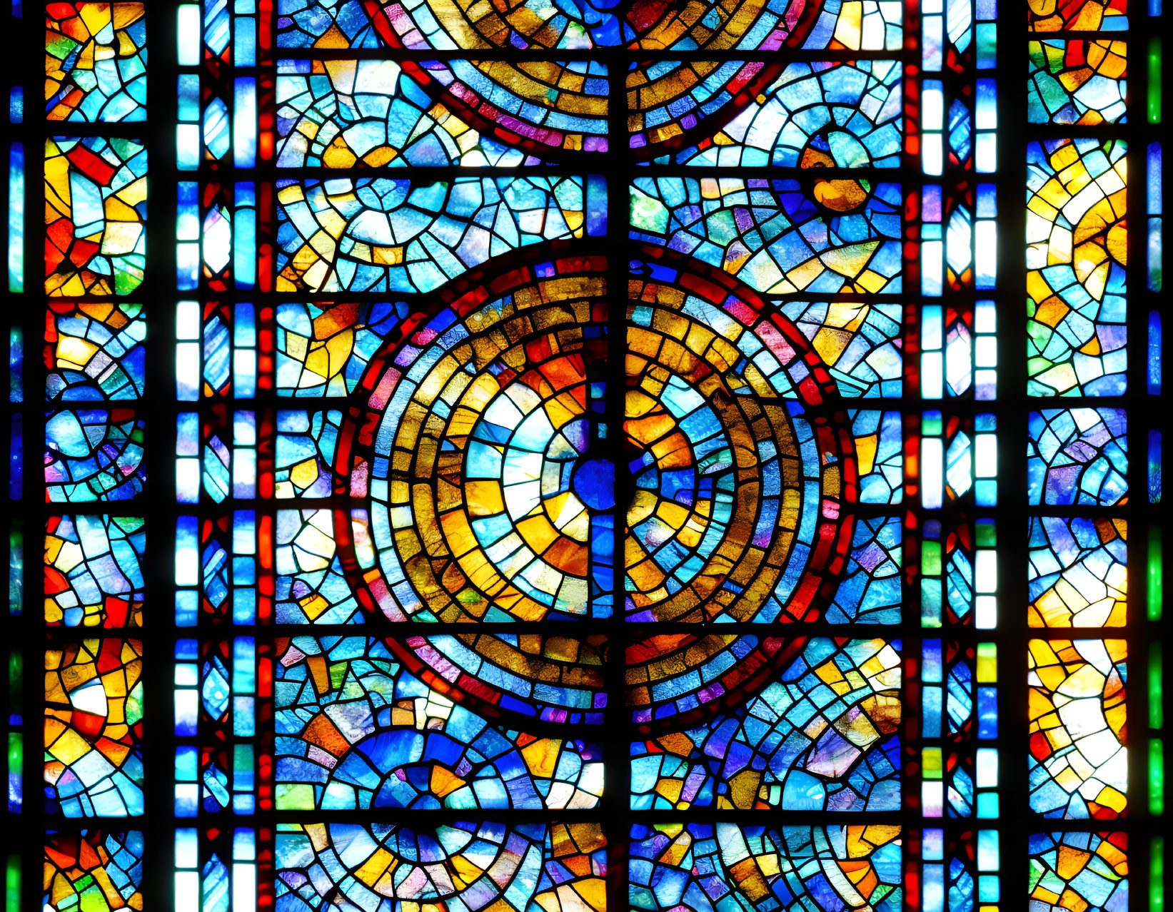 Vibrant stained-glass window with geometric patterns and circular design