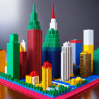 Vibrant LEGO cityscape with skyscrapers and blue river on hazy backdrop