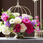 Pink and White Peonies with Purple Flowers in Birdcage Centerpiece