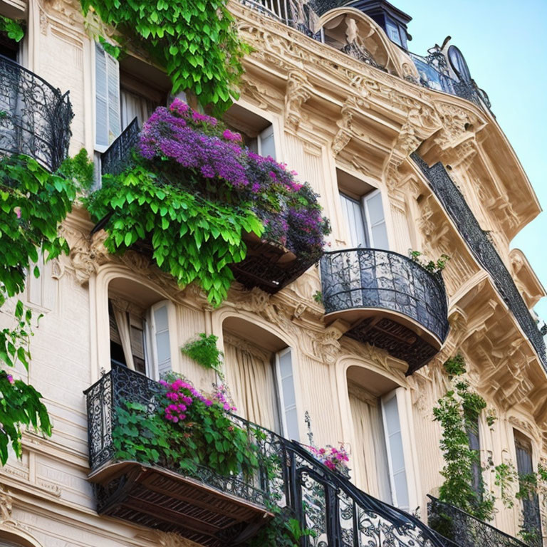 European-style building with ornate balconies and lush greenery & purple flowers against blue sky