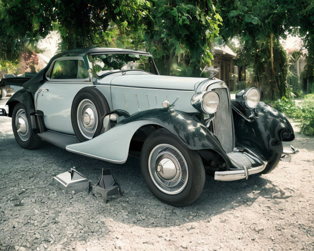 Vintage two-tone car with whitewall tires and chrome accents in nature setting