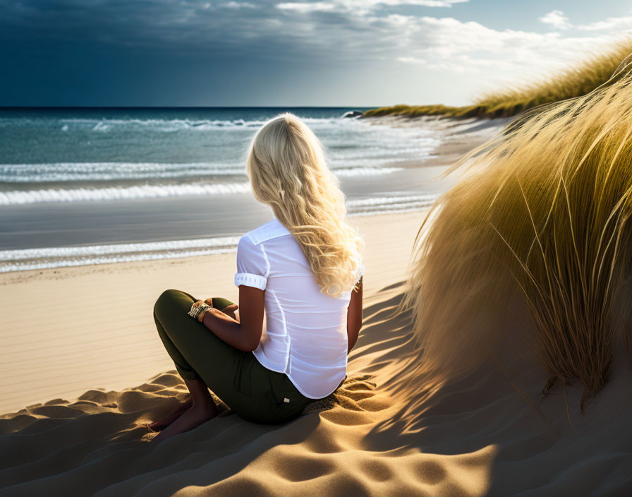 Blonde Woman Sitting on Sandy Dune by the Sea