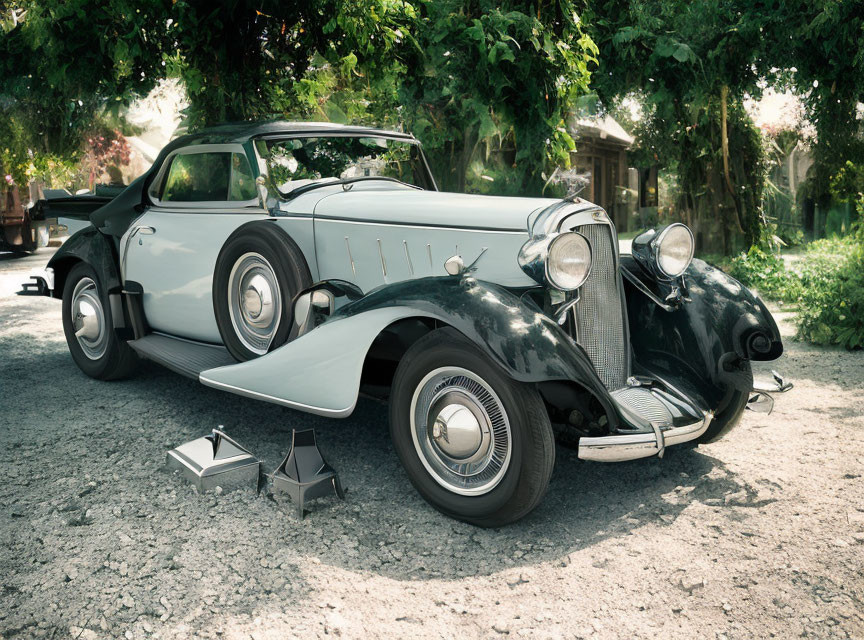 Vintage two-tone car with whitewall tires and chrome accents in nature setting