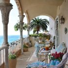 Balcony with Intricate Railings, Green Plants, Wicker Furniture & Scenic View