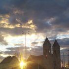 Fantasy landscape with spire-like structures under dramatic sky