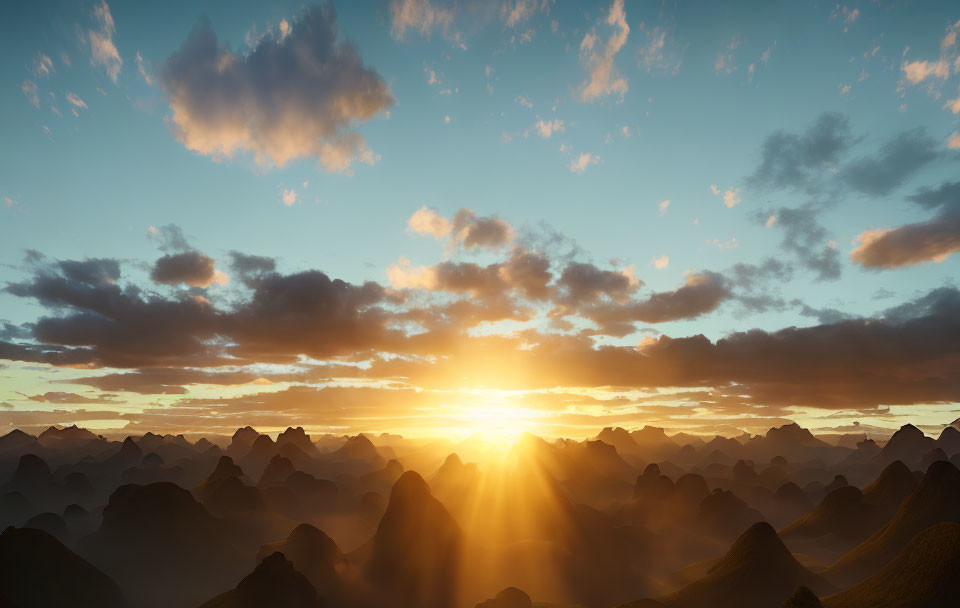 Scenic sunrise over rugged mountain landscape with scattered clouds