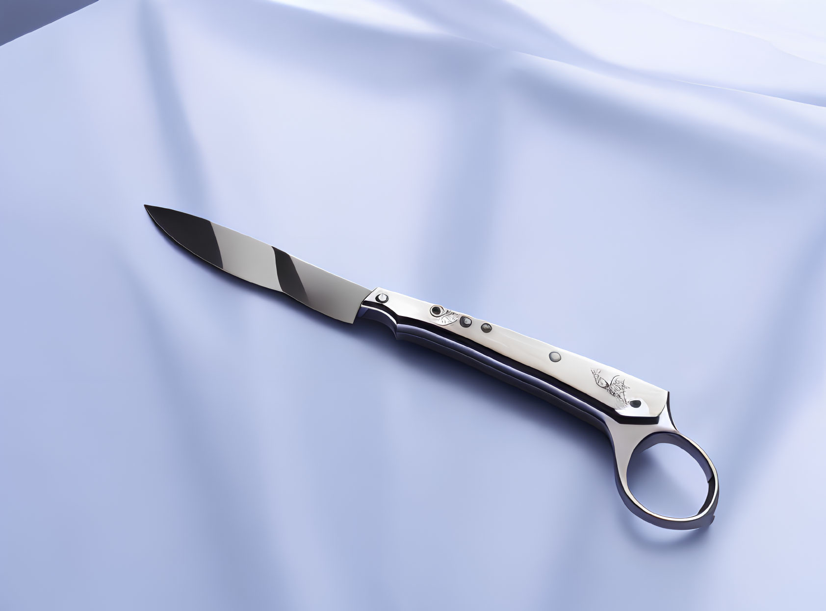 Round Finger Hole Folding Knife with Decorated Handle on Blue Satin Fabric