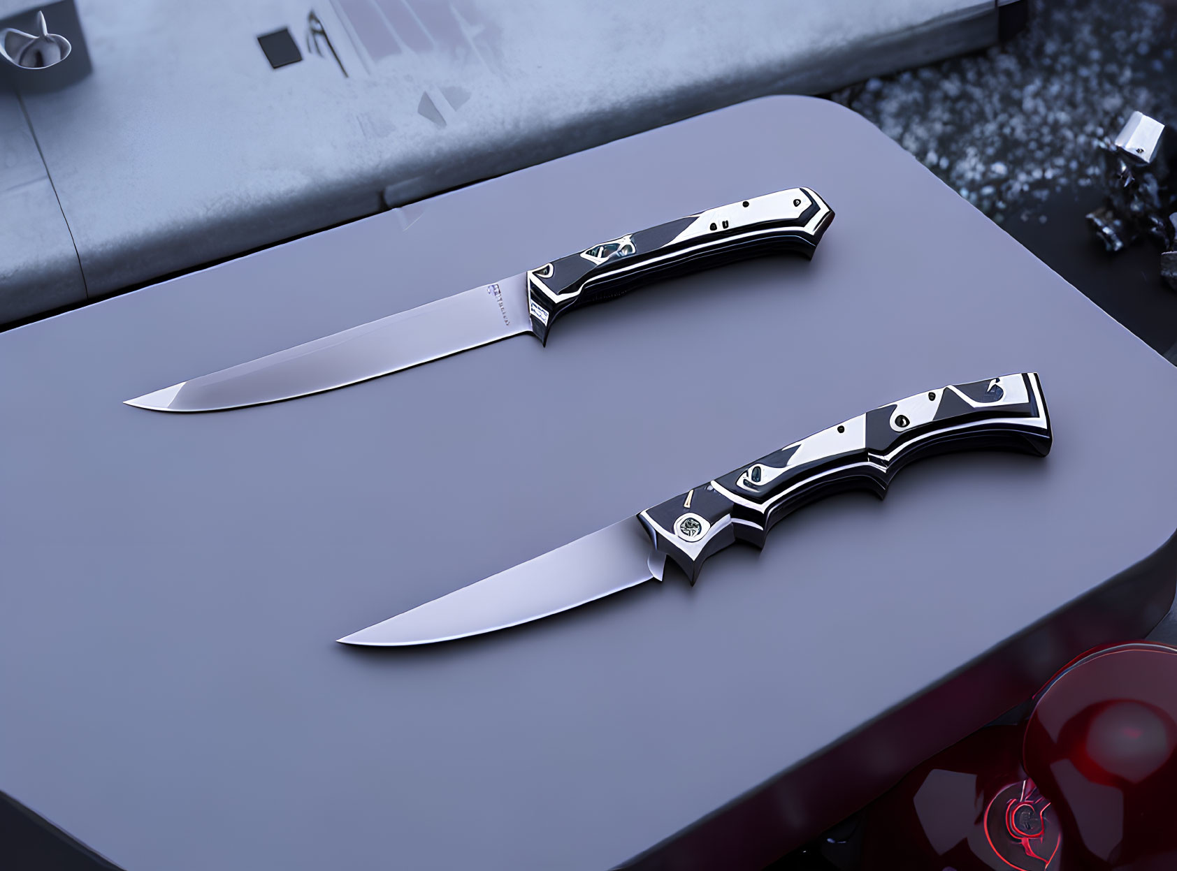 Decorative Folding Knives with Black and Silver Handles on Dark Surface