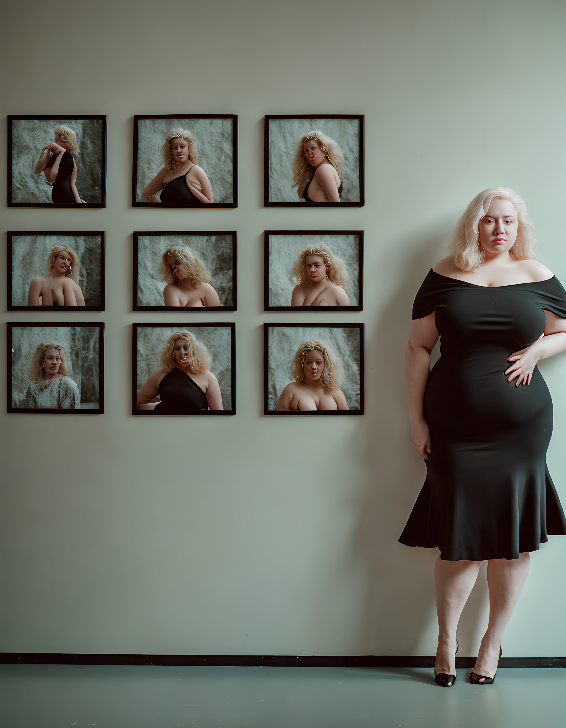 Woman in Black Dress Poses Next to Wall with Framed Photos