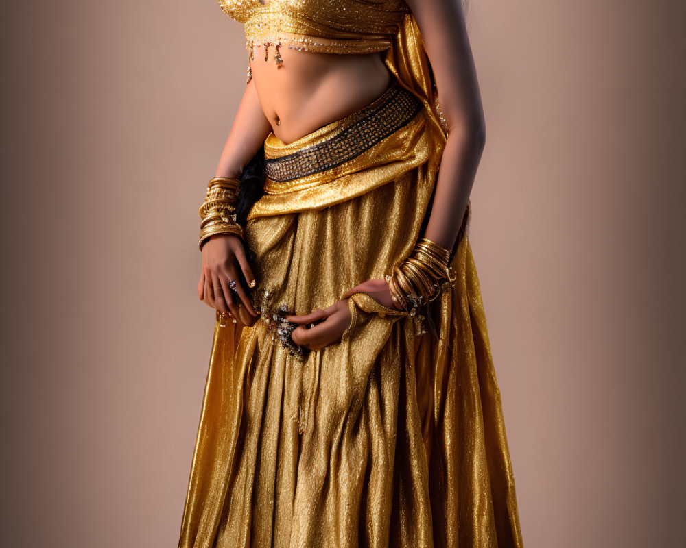 Woman in Golden Belly Dance Costume with Jewelry Pieces